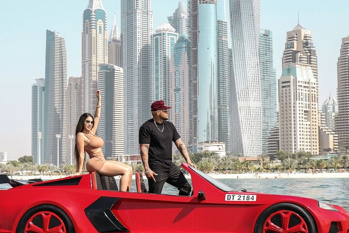 Experience the rush of Dubai's skyline from the driver’s seat of a powerful jet car zipping past iconic landmarks and stunning city views for an unforgettable journey.